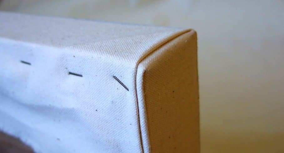 Close-up of a well-folded canvas corner and stretcher bar