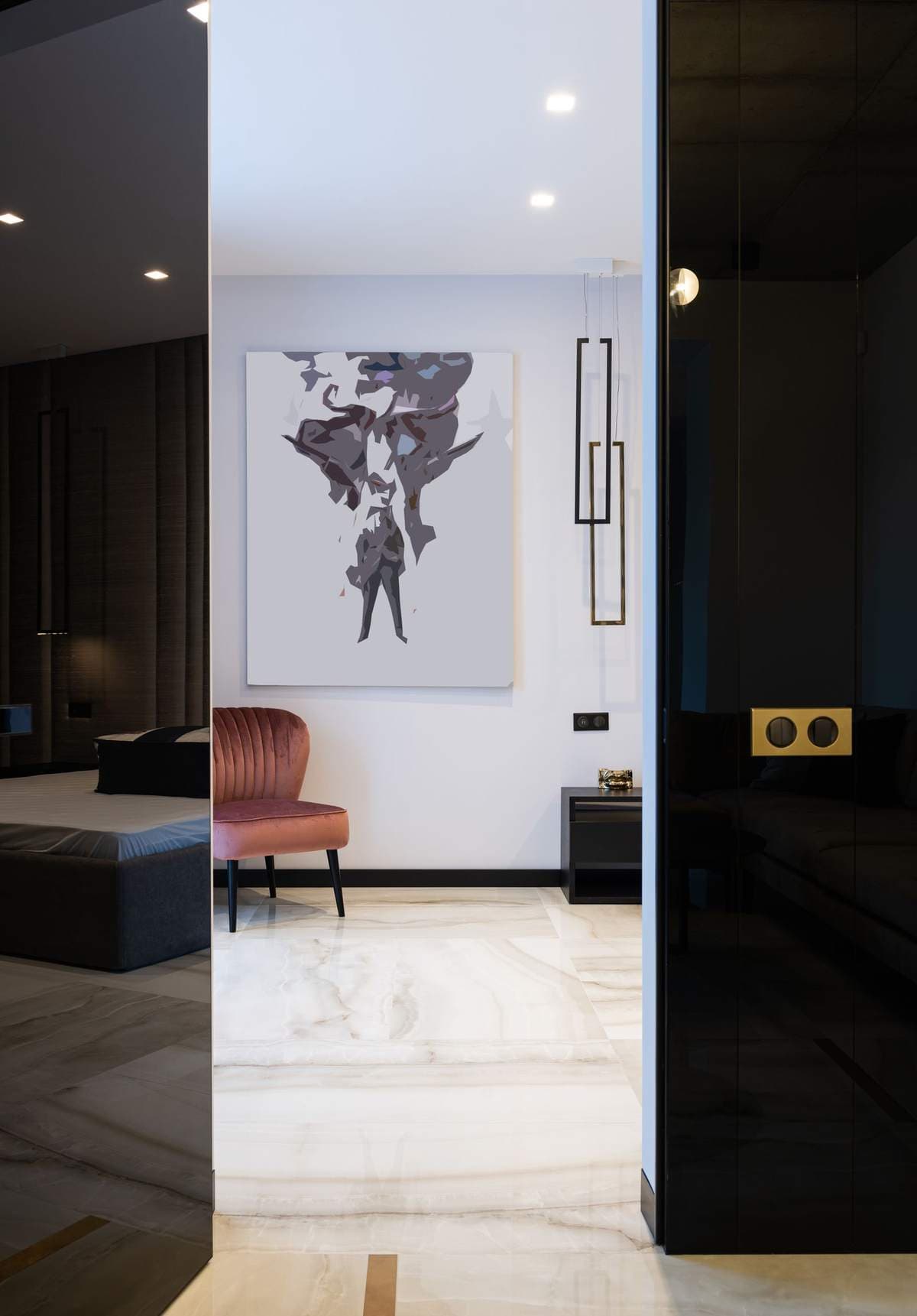 Large frameless abstract print hanging on a white wall in a modern marble-floored apartment